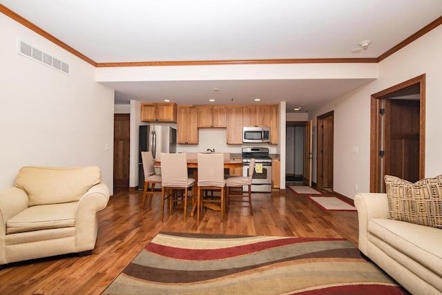 living room featuring ornamental molding and dark hardwood / wood-style floors