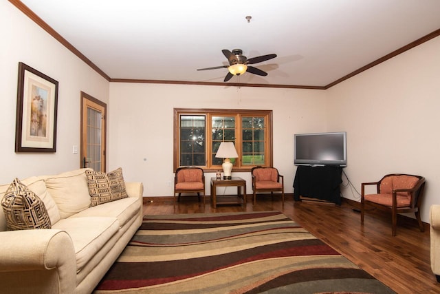 living room featuring dark wood-type flooring, ornamental molding, and ceiling fan