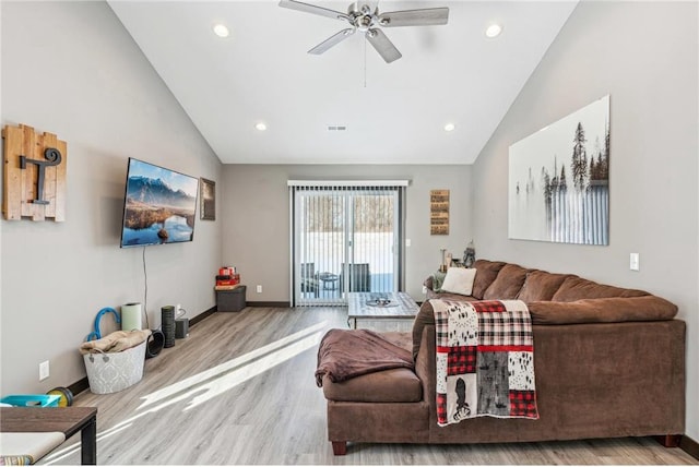 living room featuring ceiling fan, wood-type flooring, and high vaulted ceiling