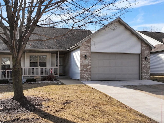 ranch-style house with a porch, a garage, and a front lawn