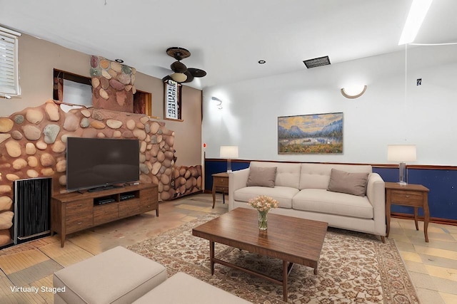 living room featuring ceiling fan