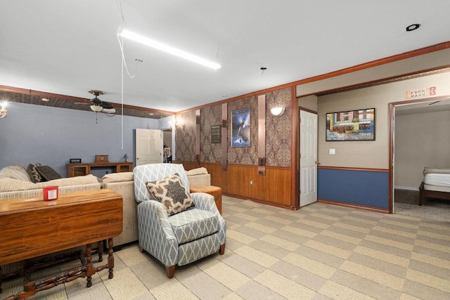 living area with light colored carpet and wood walls