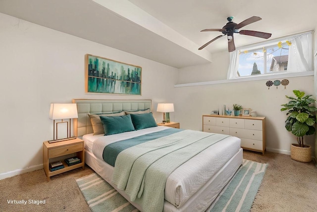 bedroom with ceiling fan and light carpet