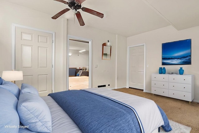 carpeted bedroom featuring ceiling fan