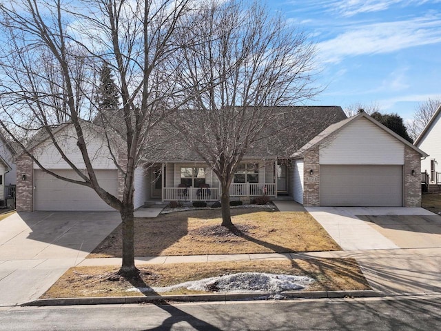 view of front of house with a garage and covered porch