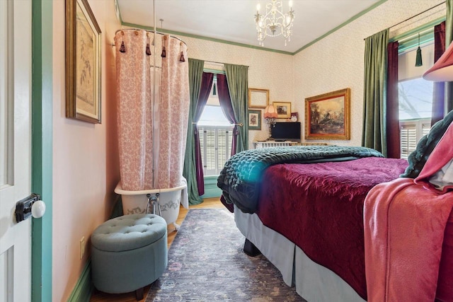 126 E Washington St, Stoughton, WI 53589 - bedroom featuring multiple windows, a chandelier, wood finished floors, and crown molding