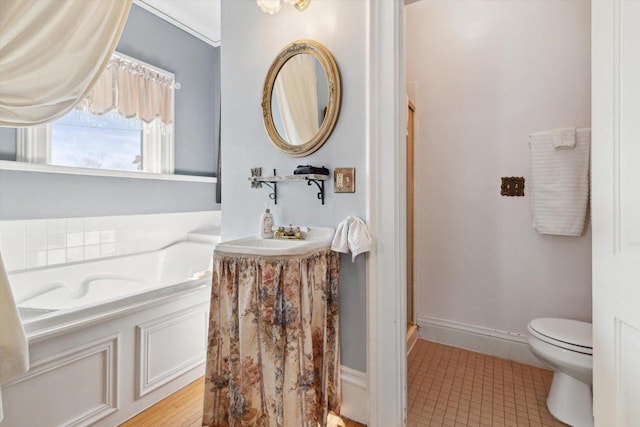 126 E Washington St, Stoughton, WI 53589 - bathroom featuring toilet, a bath, tile patterned flooring, vanity, and a stall shower