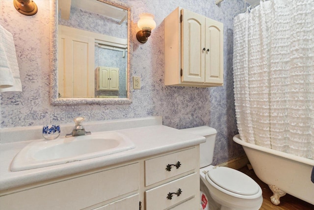 126 E Washington St, Stoughton, WI 53589 - bathroom with vanity, wallpapered walls, a bathtub, toilet, and a shower with shower curtain