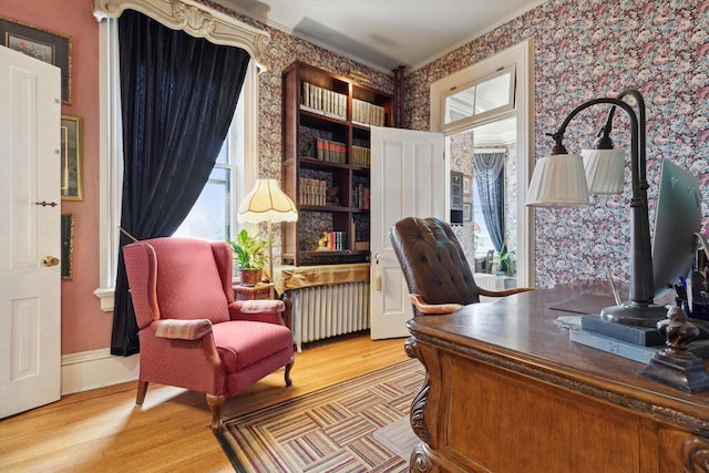 126 E Washington St, Stoughton, WI 53589 - office with radiator, wallpapered walls, and wood finished floors