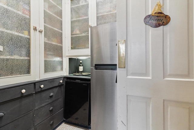 126 E Washington St, Stoughton, WI 53589 - kitchen featuring freestanding refrigerator and glass insert cabinets