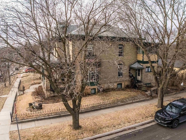 126 E Washington St, Stoughton, WI 53589 - view of front facade with a fenced front yard