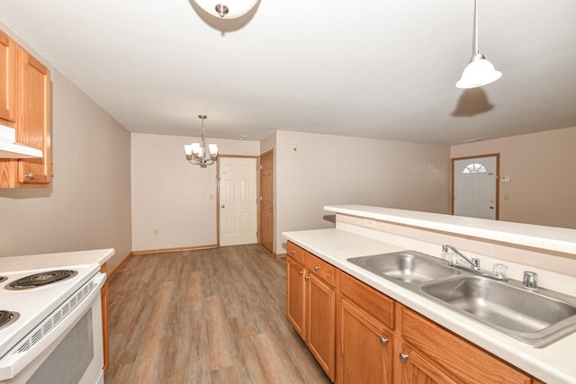 kitchen featuring pendant lighting, sink, electric range, light hardwood / wood-style floors, and an inviting chandelier