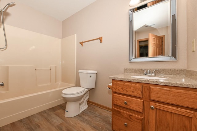 full bathroom with vanity, wood-type flooring, toilet, and shower / bath combination