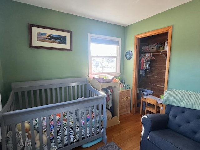 bedroom featuring hardwood / wood-style flooring and a closet