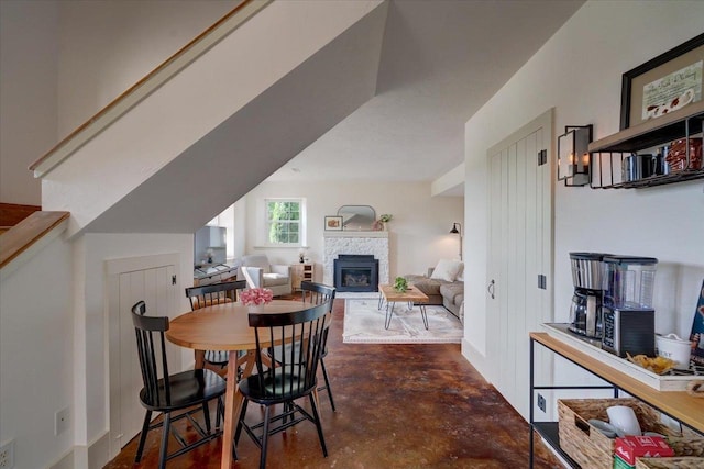 dining space featuring a fireplace