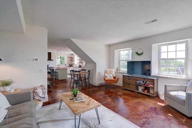 living room with a textured ceiling