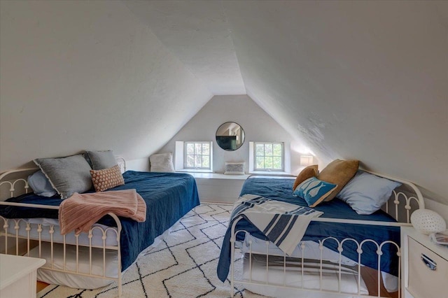 bedroom featuring lofted ceiling