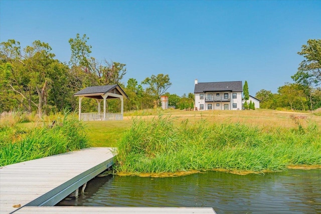 dock area featuring a gazebo and a water view