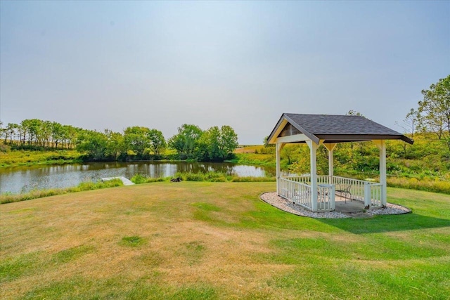 view of yard featuring a water view and a gazebo