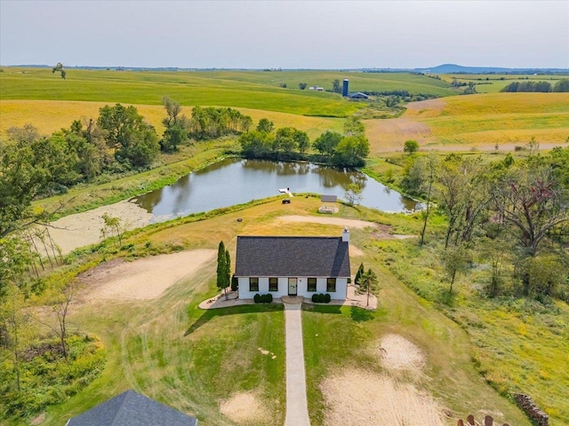 drone / aerial view featuring a water view and a rural view