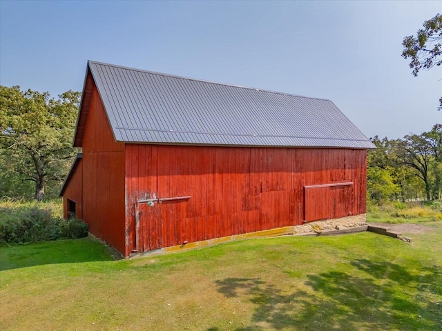 view of outdoor structure with a lawn