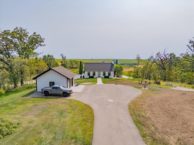 view of front of house featuring a garage and a front yard