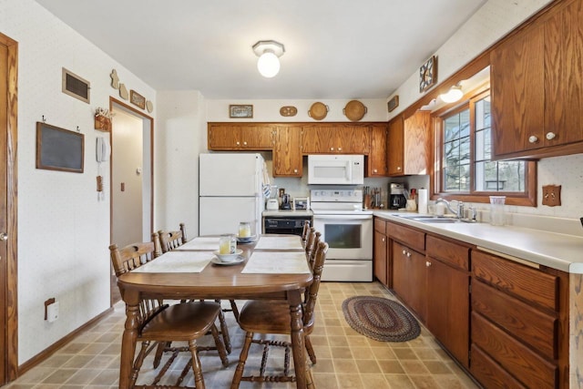 kitchen featuring sink and white appliances