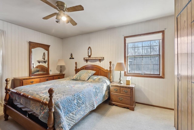 bedroom featuring light carpet and ceiling fan