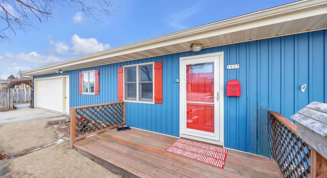 view of exterior entry featuring a garage