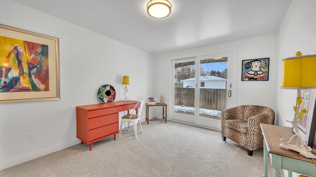 living area with light carpet