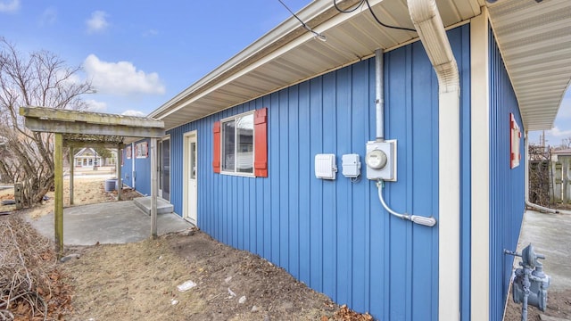 view of side of home featuring a patio