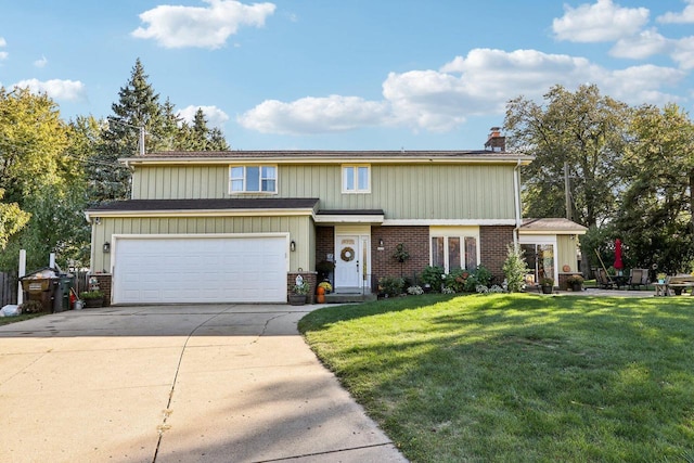 view of front of property featuring a garage and a front yard