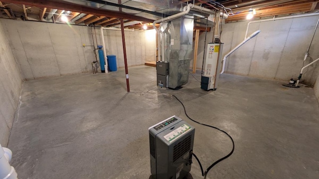 basement with gas water heater and heating unit