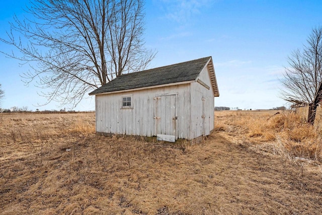 view of outbuilding with a rural view