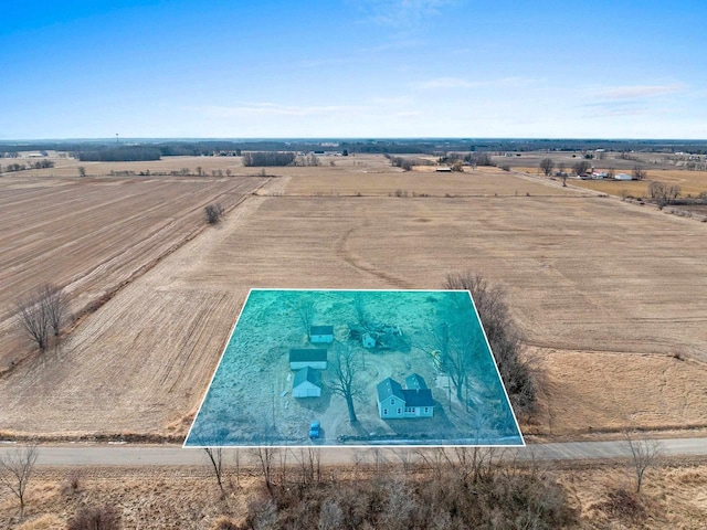 birds eye view of property with a rural view