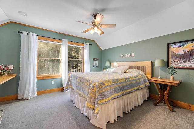 bedroom featuring lofted ceiling, light carpet, and ceiling fan