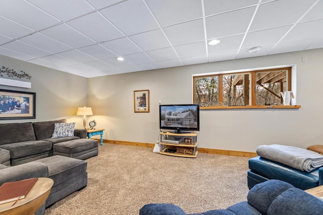 living room with carpet and a drop ceiling