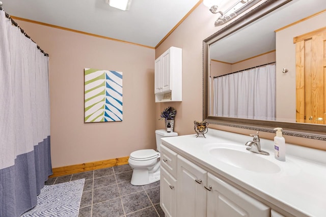 bathroom featuring ornamental molding, vanity, and toilet