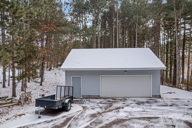 view of snow covered garage