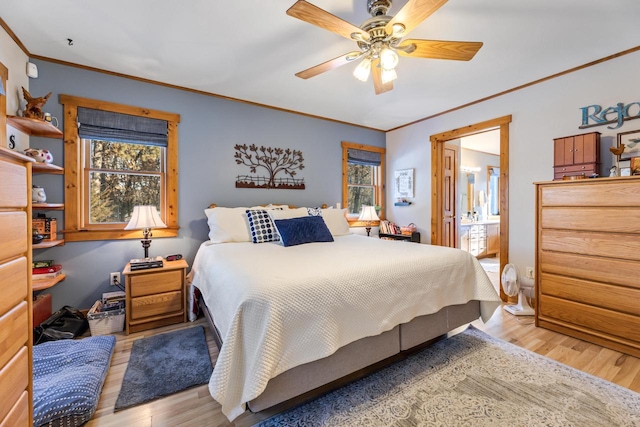 bedroom featuring crown molding, ensuite bath, ceiling fan, and light hardwood / wood-style floors