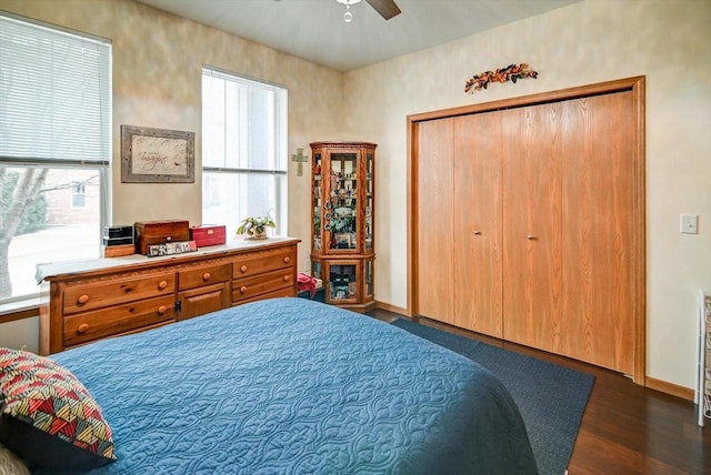 bedroom with ceiling fan and dark hardwood / wood-style flooring