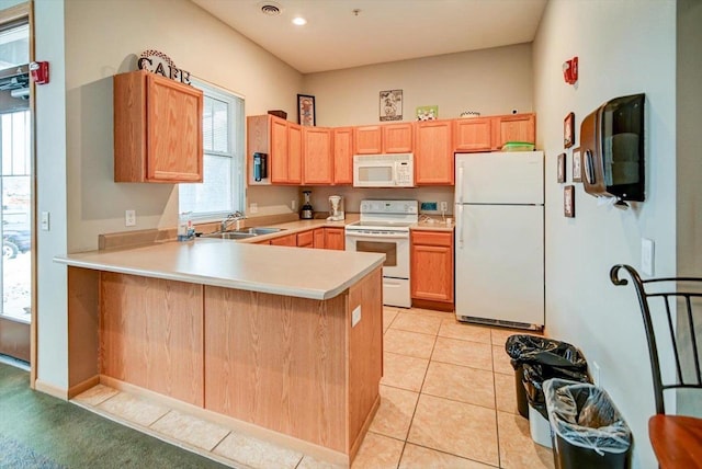 kitchen with sink, white appliances, kitchen peninsula, and light tile patterned flooring