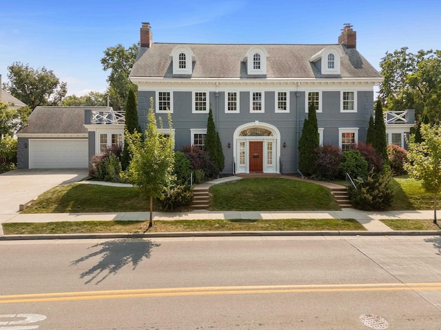 colonial-style house featuring a garage