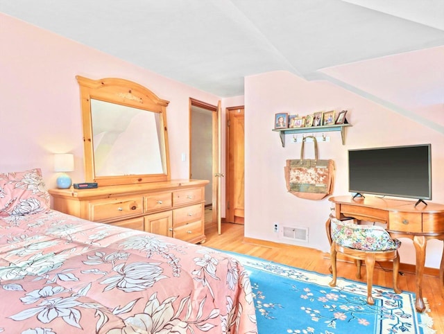 bedroom with light hardwood / wood-style floors