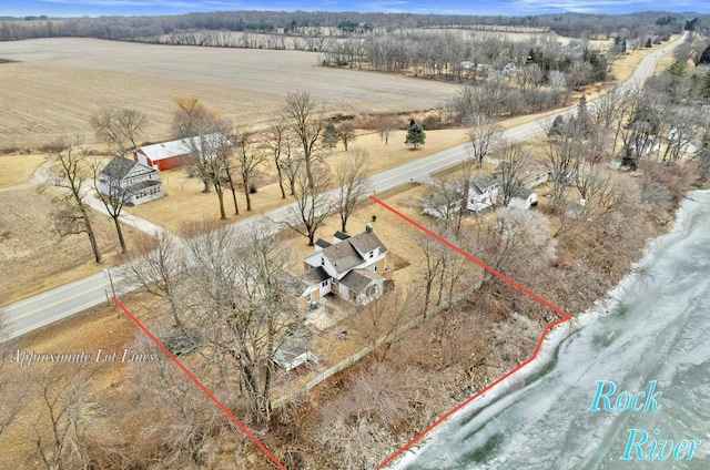 birds eye view of property with a rural view