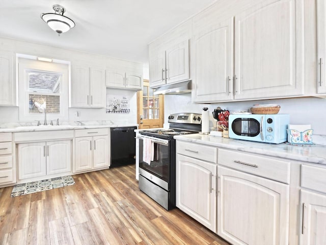 kitchen featuring electric stove, sink, white cabinetry, and black dishwasher