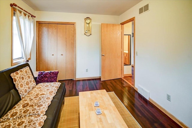 living room with dark hardwood / wood-style flooring