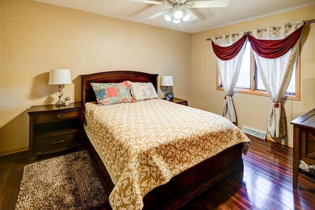 bedroom with dark wood-type flooring and ceiling fan