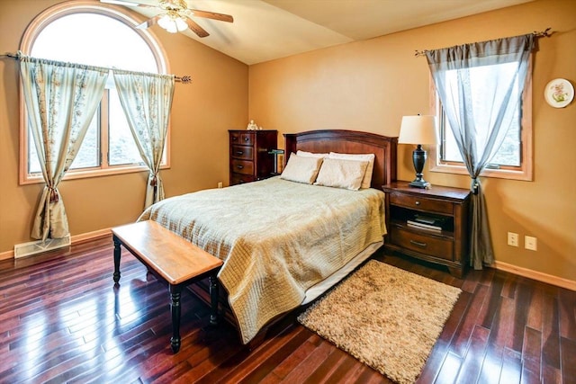 bedroom featuring dark hardwood / wood-style flooring and lofted ceiling