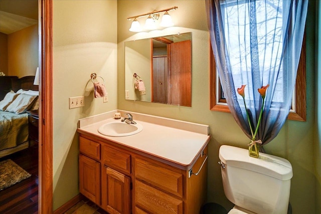 bathroom with vanity and toilet